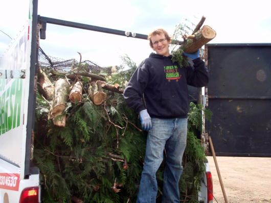 Cein offloading the green waste into the compost pile-1.7 tonnes of green matter composted!